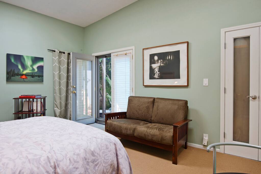 Small couch in room. and french door entry.