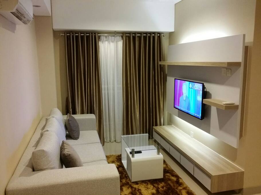 Living room with best quality sofa and 40inch TV.