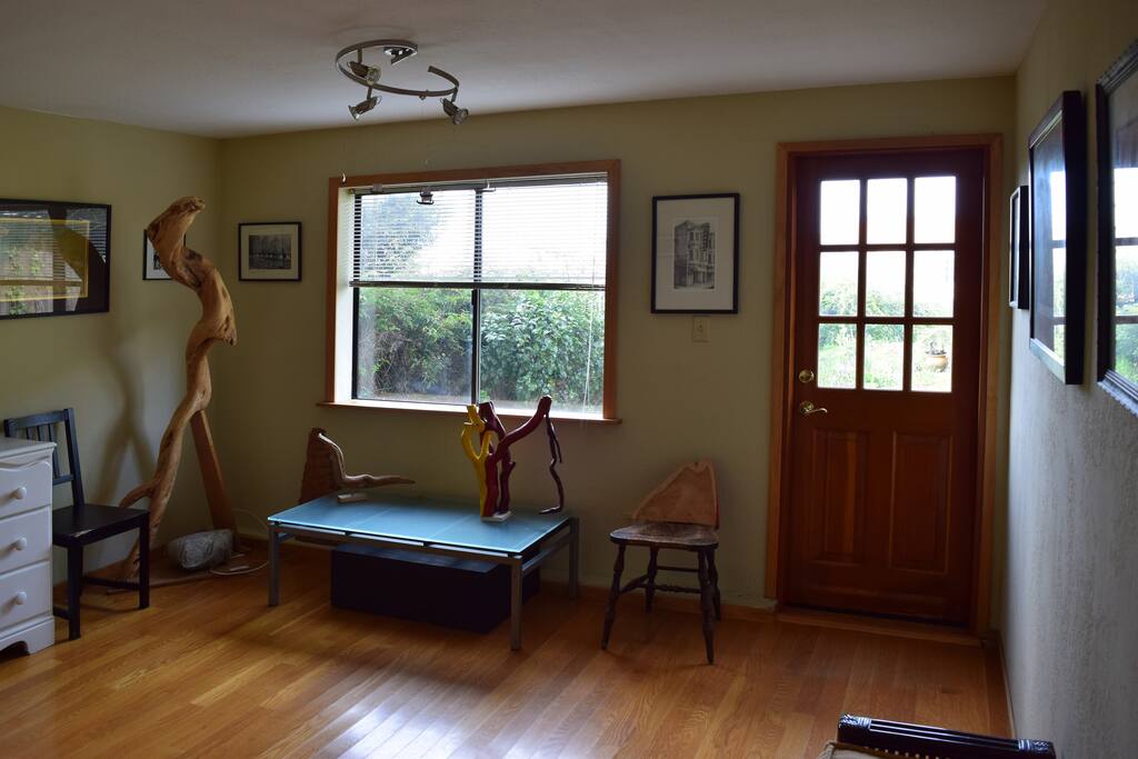 Sunny living room opens to private garden.