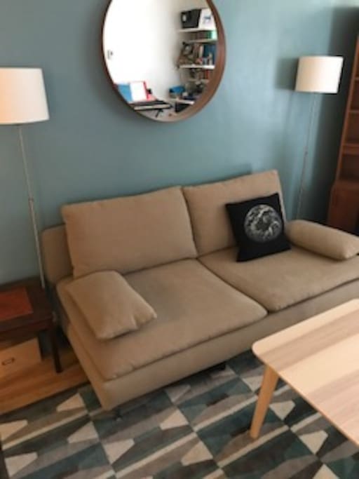 Cozy living room with fan. Lights are connected to the switch by the bookcase. Feel free to leave them on at night when you leave.