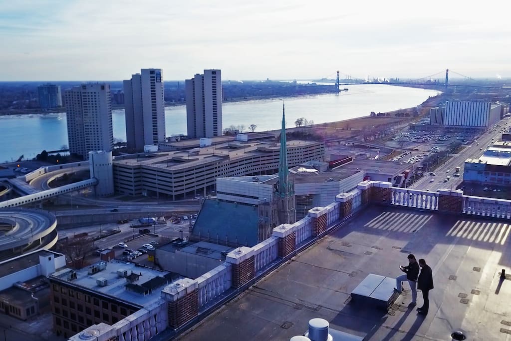 30'x60' private rooftop terrace + view into Canada and Ambassador Bridge.