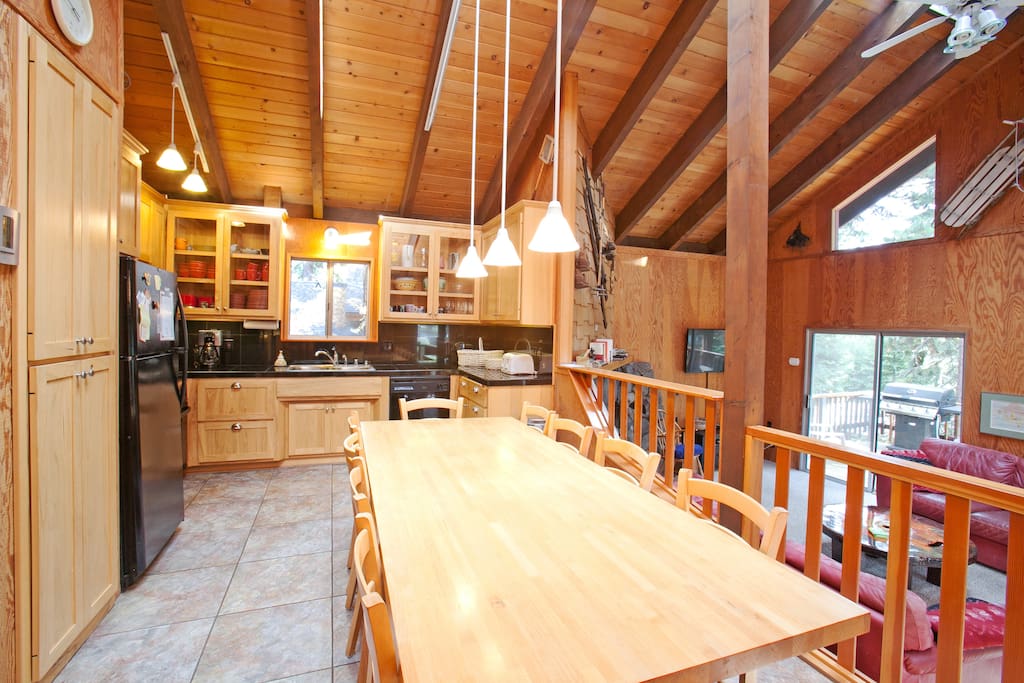 Another view of the kitchen. Huge table seats 10 comfortably - more if you squish.