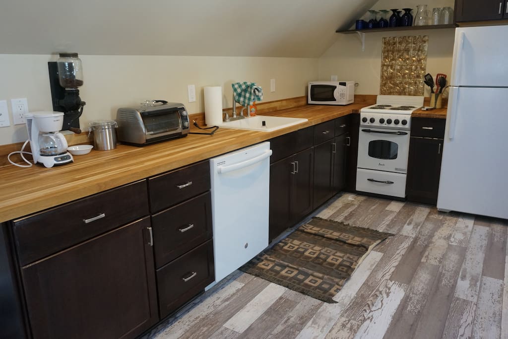 Kitchen offers oven, range, refrigerator, dishwasher, coffee, microwave, and toaster oven