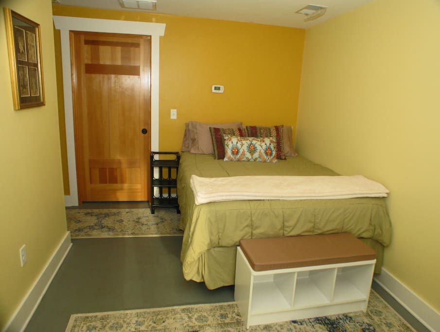 The room features a brand new Queen size mattress.