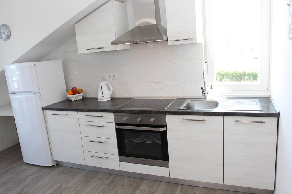 a fully equipped kitchen (dish washer, oven, kettle)