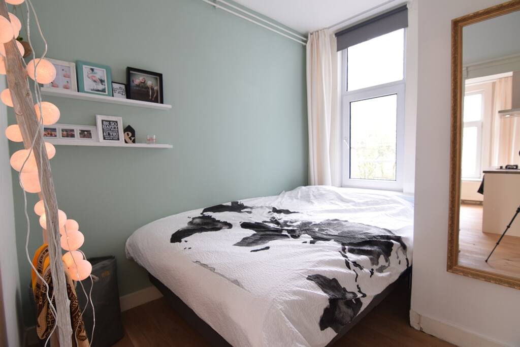 Tiny, but cosy bedroom with a box spring.