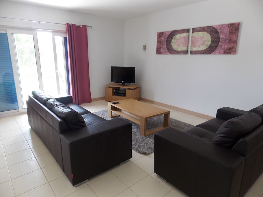 Living area. Tv , DVD , play station2 . Large sofa double bed settee