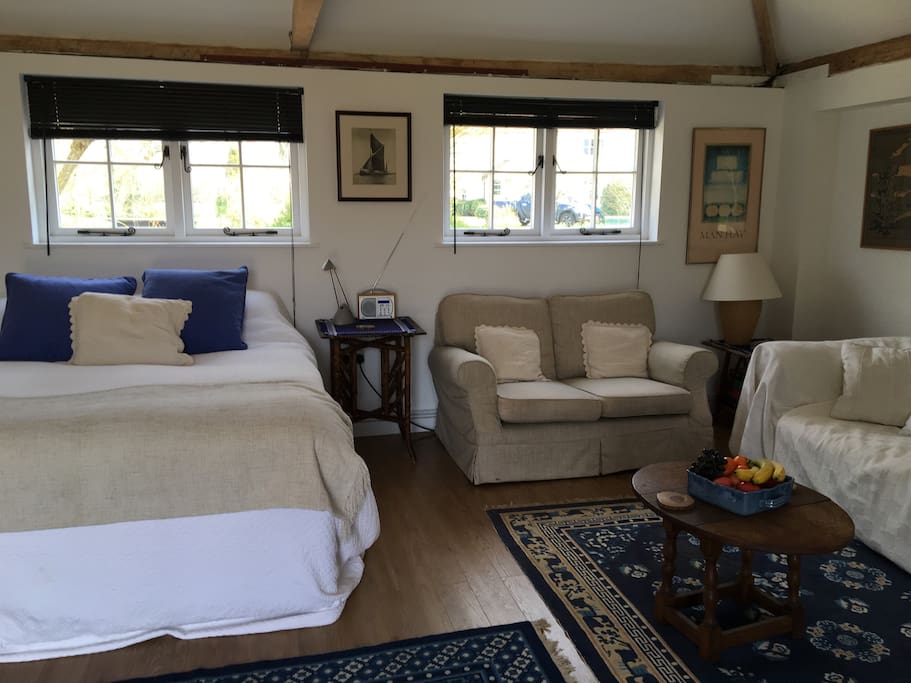 Large bed-sitting room. King size bed and two sofas