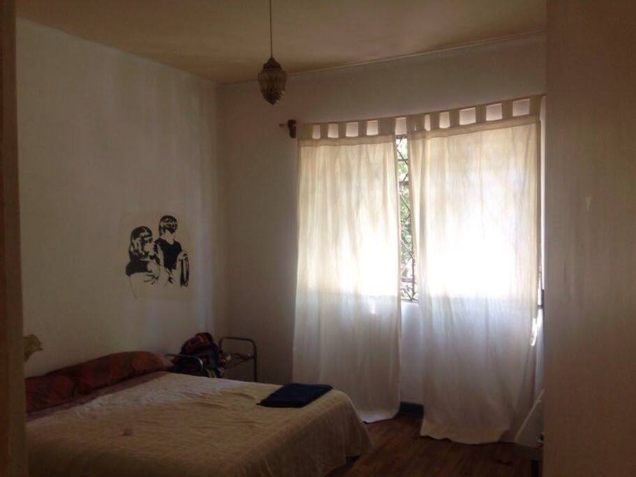 Large bedroom with built-in wardrobe.