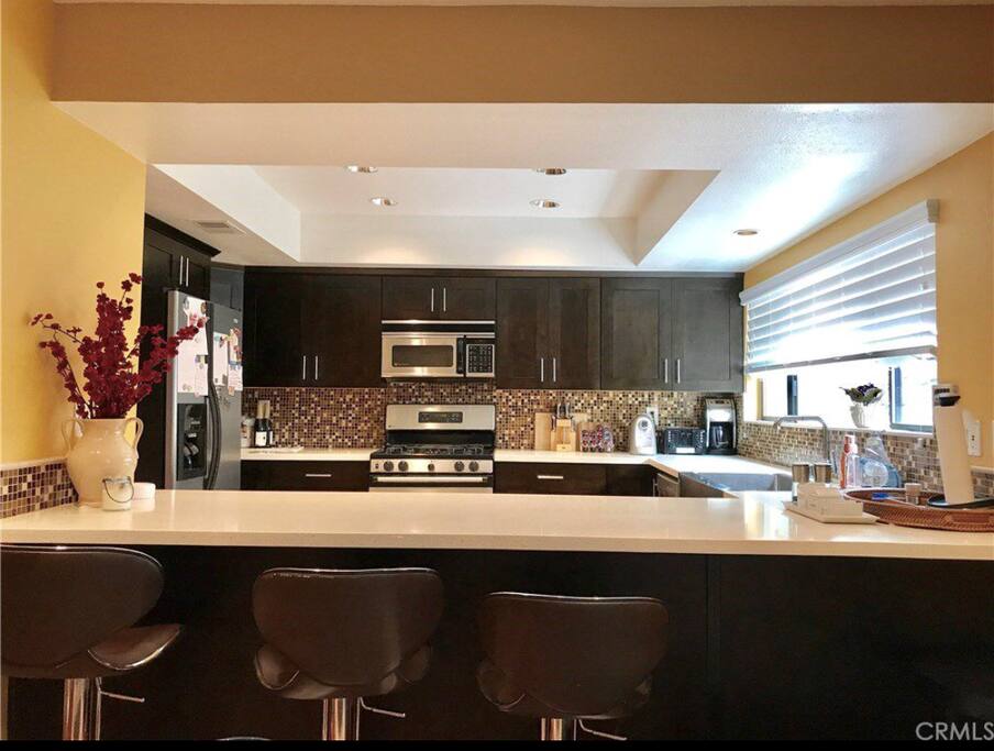 The large breakfast bar opens to the enticing family room ideal for relaxing.