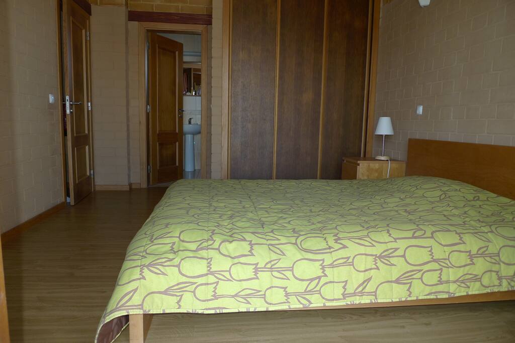 Master bedroom looking towards the en-suite – like all the bedrooms it has a traditional high wooden ceiling
