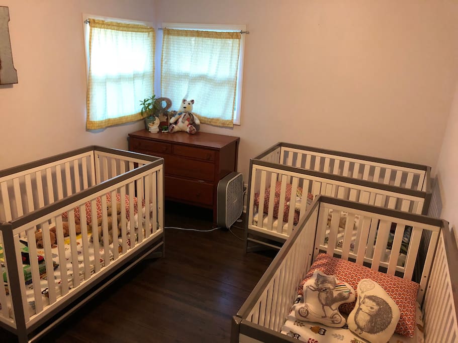 3 cribs set up - easily moved to another room for kiddos, or removed for a family who doesn't need them and would rather have an air mattress