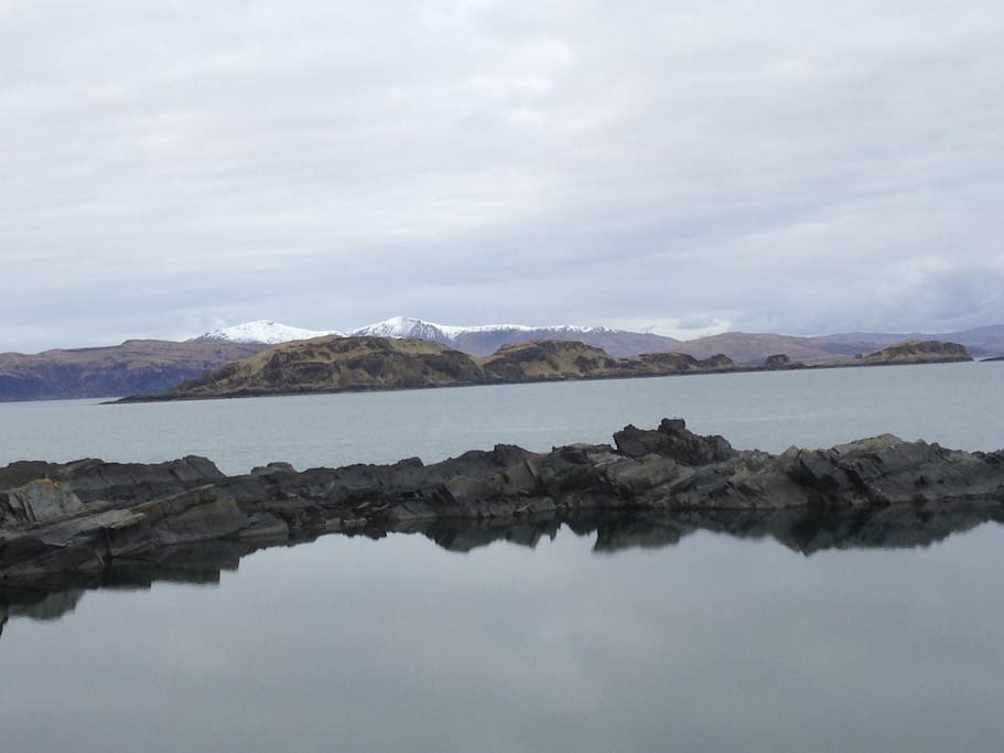 Looking across one of the flooded quarries to Mull