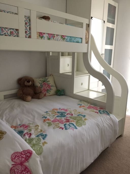 Triple sleeper bunk bed (3ft Single bed on top, 4ft6" Double bed at bottom). Storage stairs to upper bed.