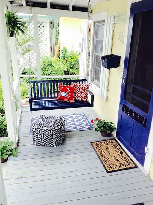 Inviting porch to enjoy sunset cocktails overlooking the water & new marina