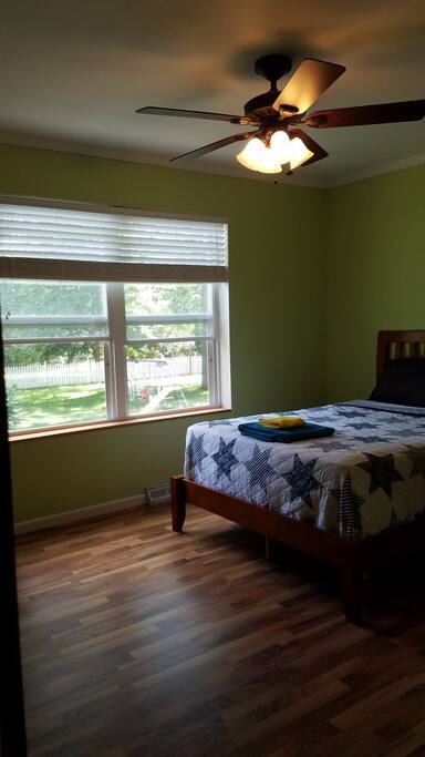 Spacious room with lots of natural light, ceiling fan and closet.