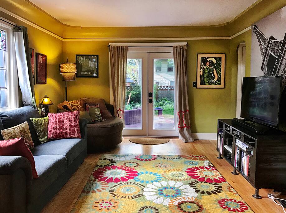 Living room with doors leading to the back deck