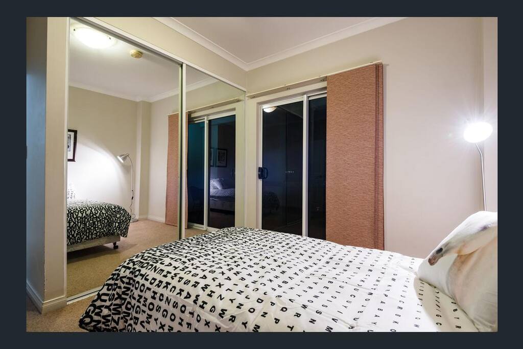 This is your bedroom. Very big closet for your clothes. Direct access to private balcony. Please note that the bed in the photo has been replaced by a full Queen mattress, very comfortable for 2 people.
