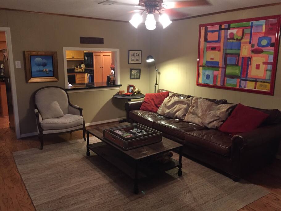 Spacious living room with kitchen access.