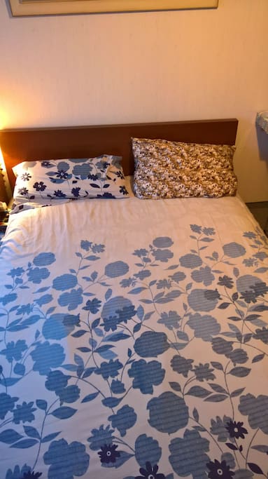 Bed with flowers bedsheet