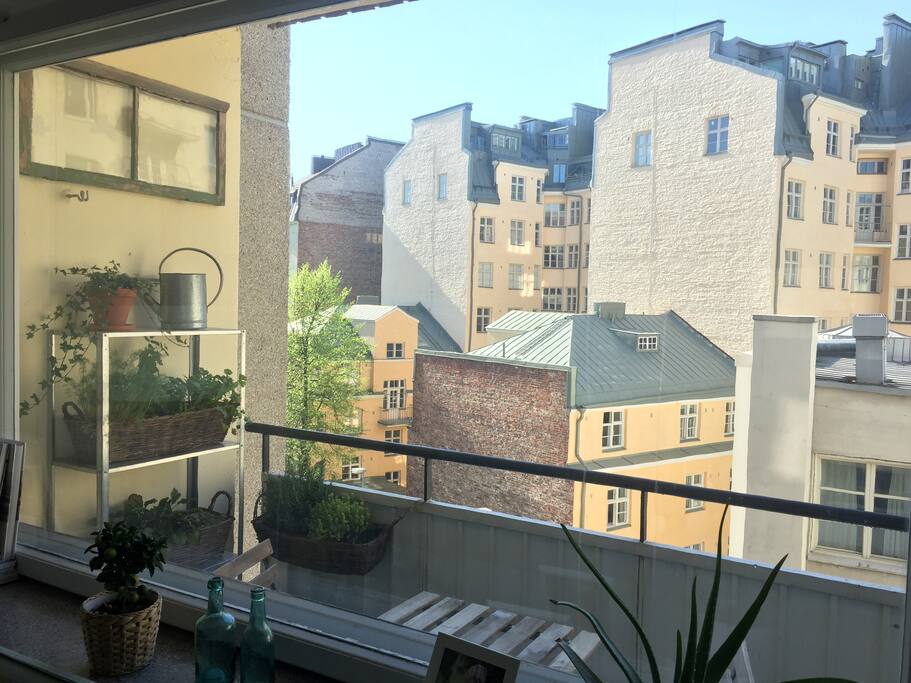The balcony has a south view to inner yard and there is a coffee table with two chairs for you to enjoy.