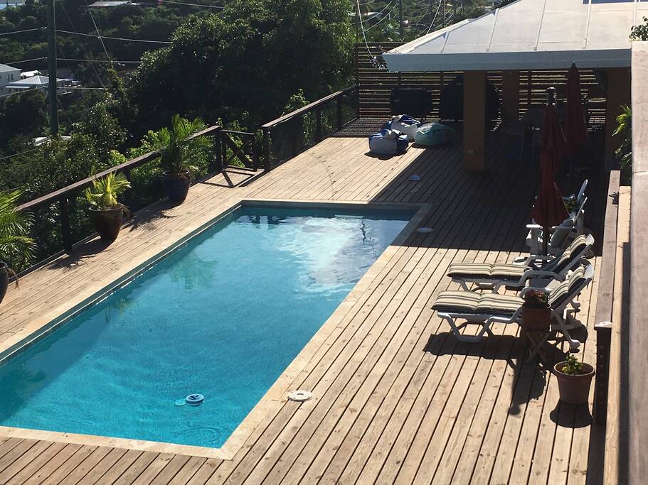 The expansive outdoor pool deck has adequate space for lounging.