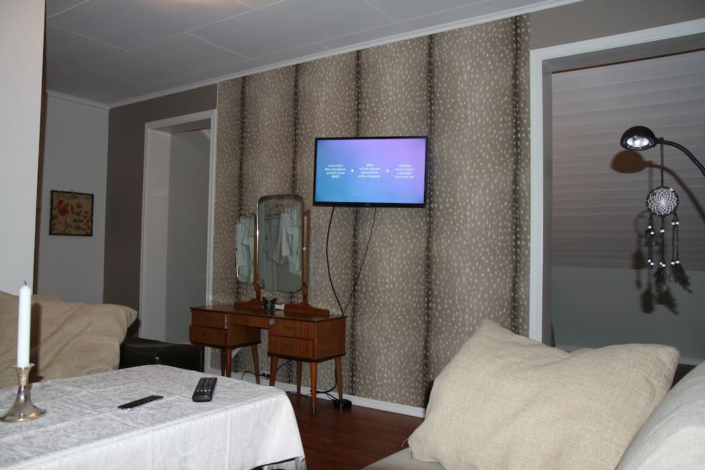 AppleTV and two double sofas.