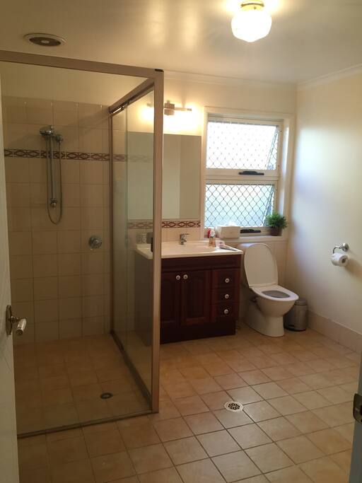 Spacious private bathroom with wheelchair access