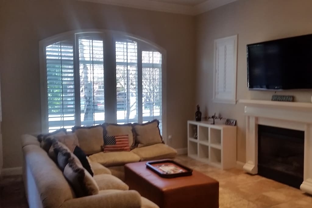 Spacious and open living room with gas fireplace