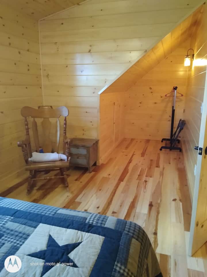 Other end of bedroom with double bed.
