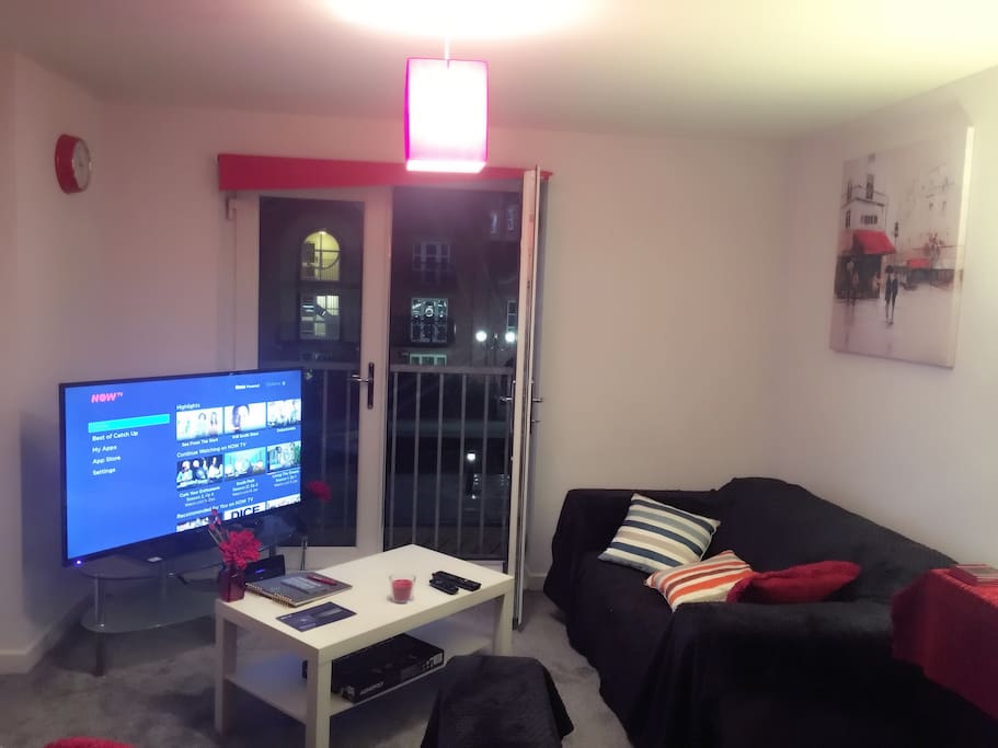 Living room. It has an open view over the canal-side. Opposite it is another balcony used primarily as a smoking area.
