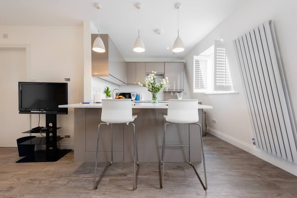 Open plan living area with TV