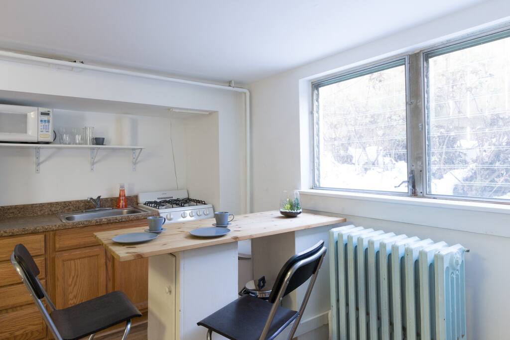 Kitchen area with island for prep or eating.