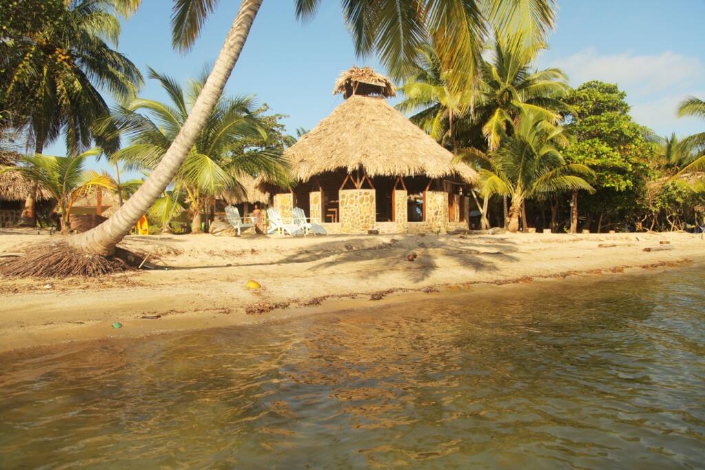 Our four cabanas and bar are nestled by the sea