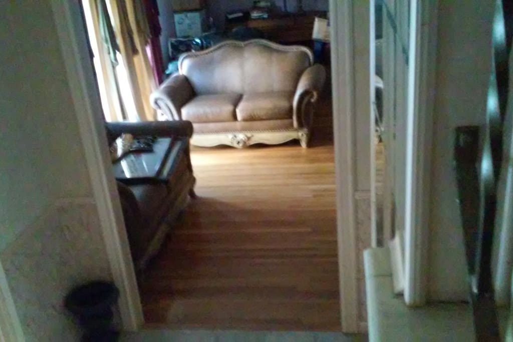 Large day window, ample seating, comfortable living room.