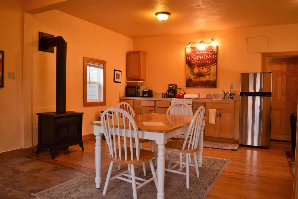 Dining and Kitchen area with cozy fireplace