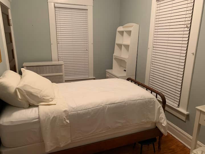 Third Bedroom with a view of the river, and two windows letting in the cool evening air. Single bed. 