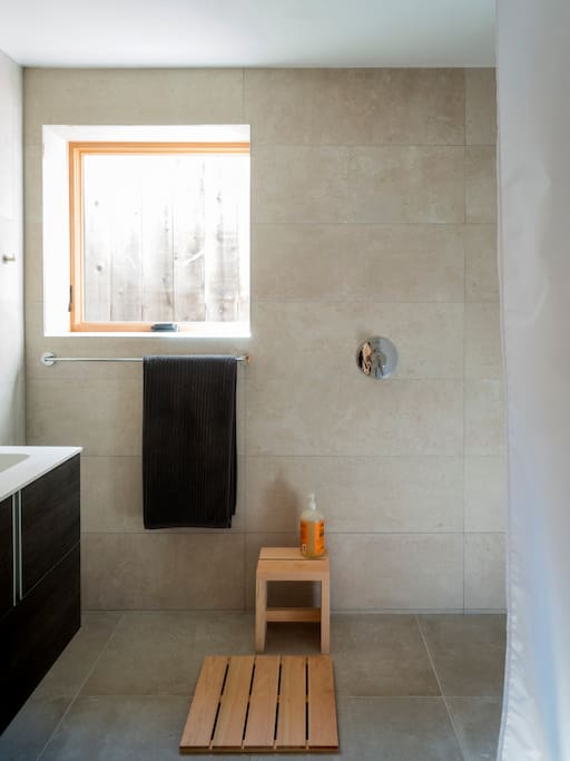 Spa-like tiled bathroom with curbless shower.
