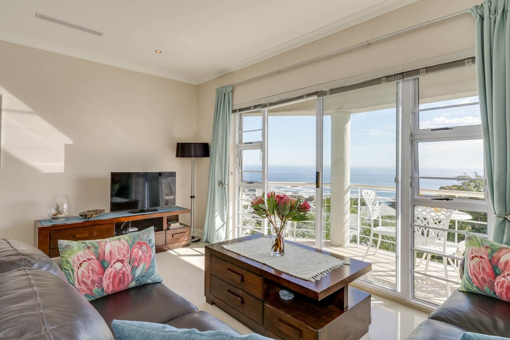 Living area leading onto the balcony offers views of the Atlantic ocean