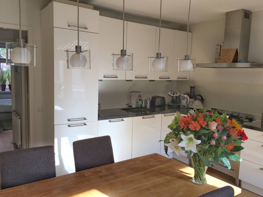 Kitchen and dining area with access to sunny balcony