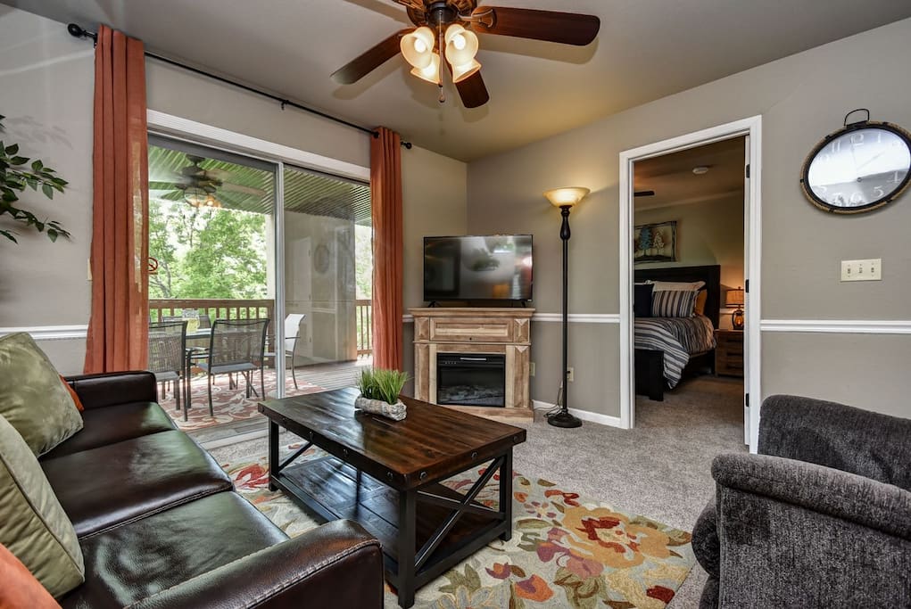 Living room has queen sleeper sofa with memory foam mattress.
