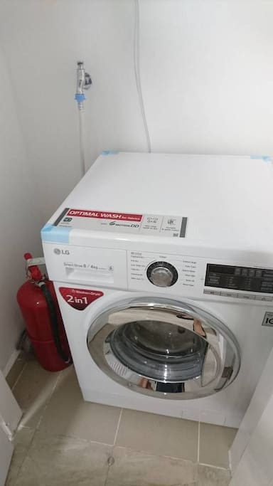 laundry machine, fire extinguisher included.