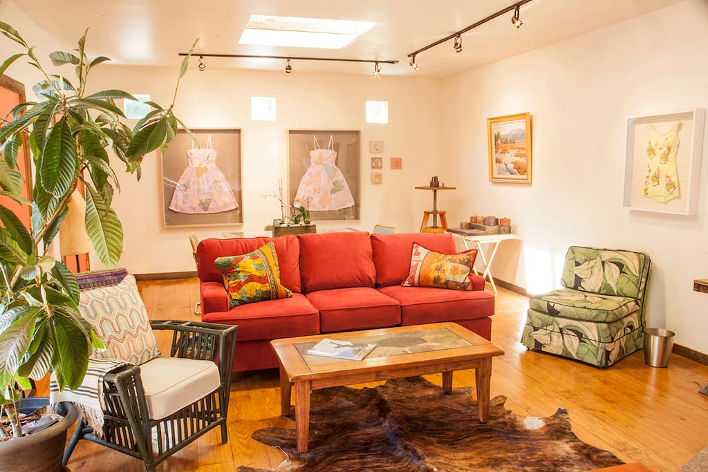The living area of main room . Pull out couch.My cast handmade paper dresses are to the rear wall.