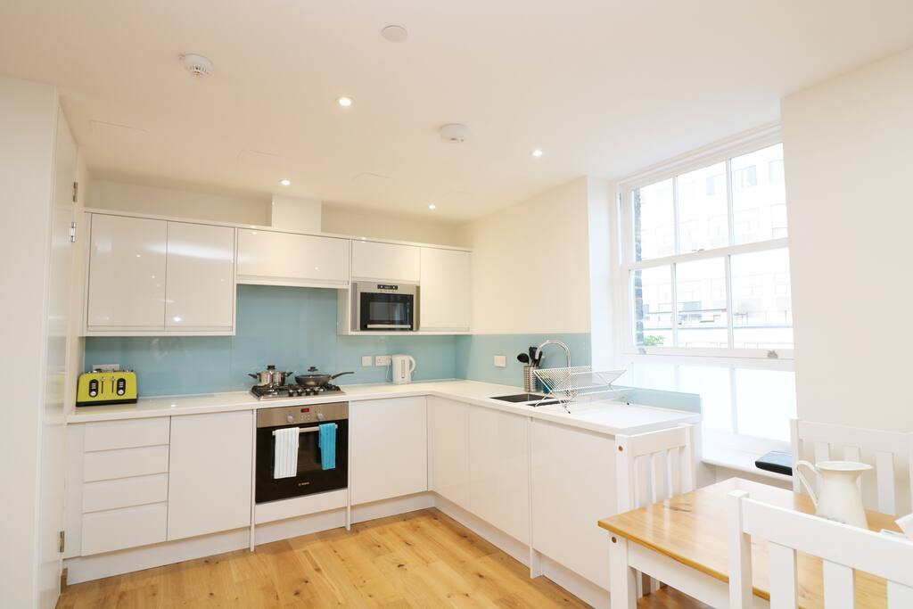 well equipped kitchen with Fridge freezer, dishwasher, washer dryer, cooker, integrated microwave, Toaster and tea kettle.