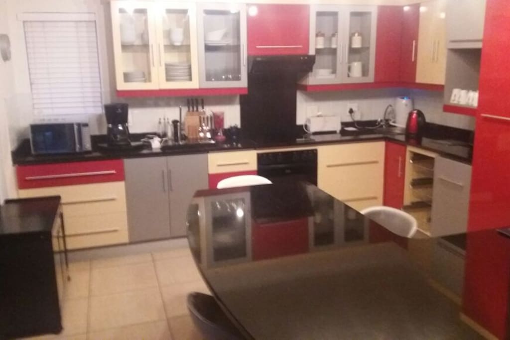 Fully equipped kitchen with open plan lounge