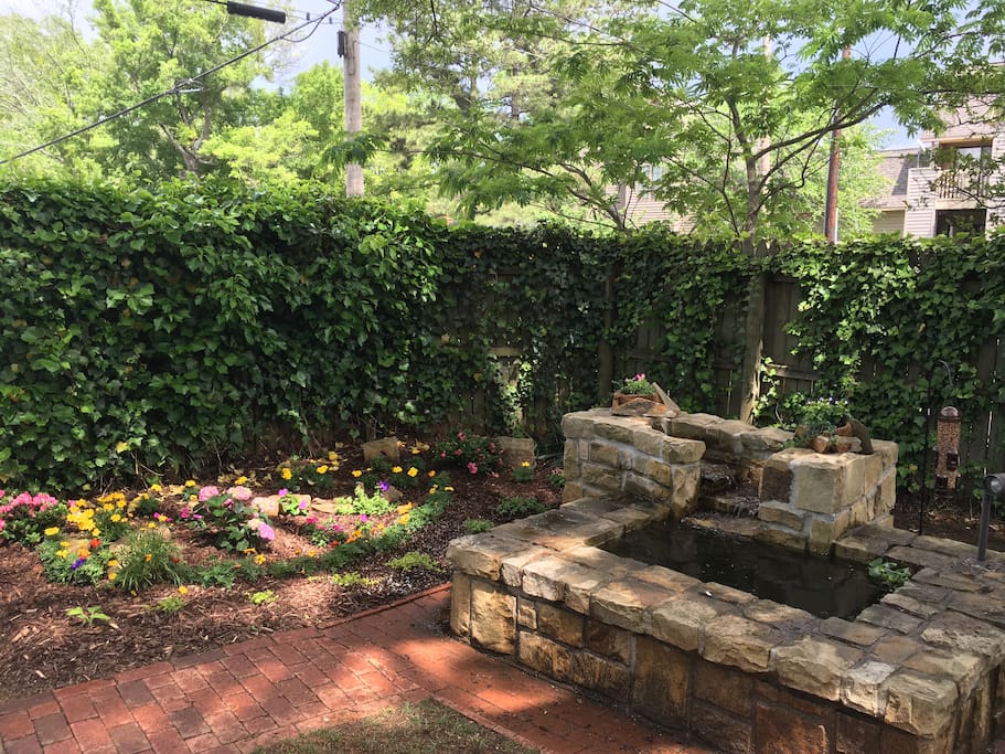 Private fenced yard with fountain & fire pit