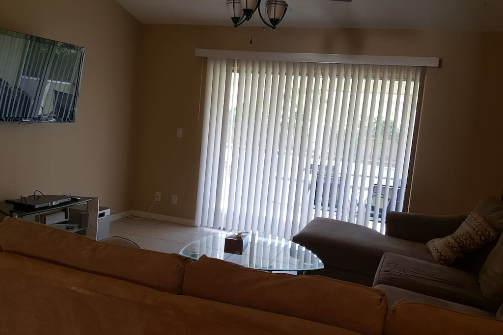 Spacious living with patio access and antenna TV plus blue ray smart capabilities.