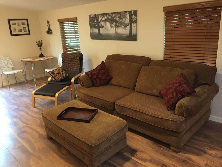 Comfortable living room with oversize sofa (that can sleep 1). Plenty of space and privacy and filled with a perfect mix of antiques and eclectic art.