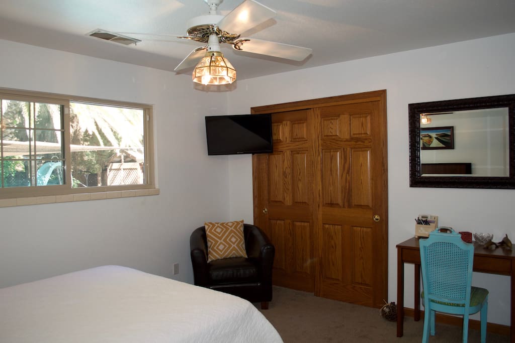 Private bedroom with closet, cable TV, and desk.