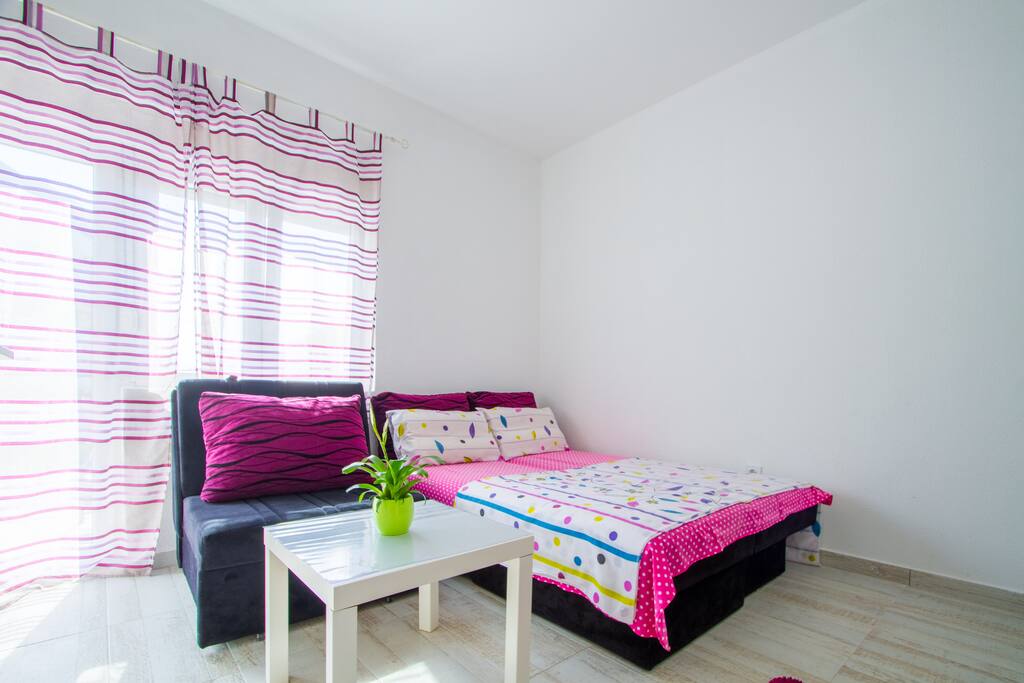 Queen Size Bed and Sofa suitable for accommodating 3 people.